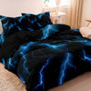 A dark blue and black duvet cover set featuring a lightning bolt print on a bed.