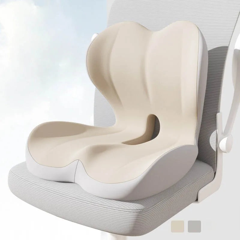 A beige ergonomic memory foam lumbar seat cushion shown in a side view.