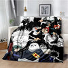 A black and white anime throw blanket featuring characters from Jujutsu Kaisen