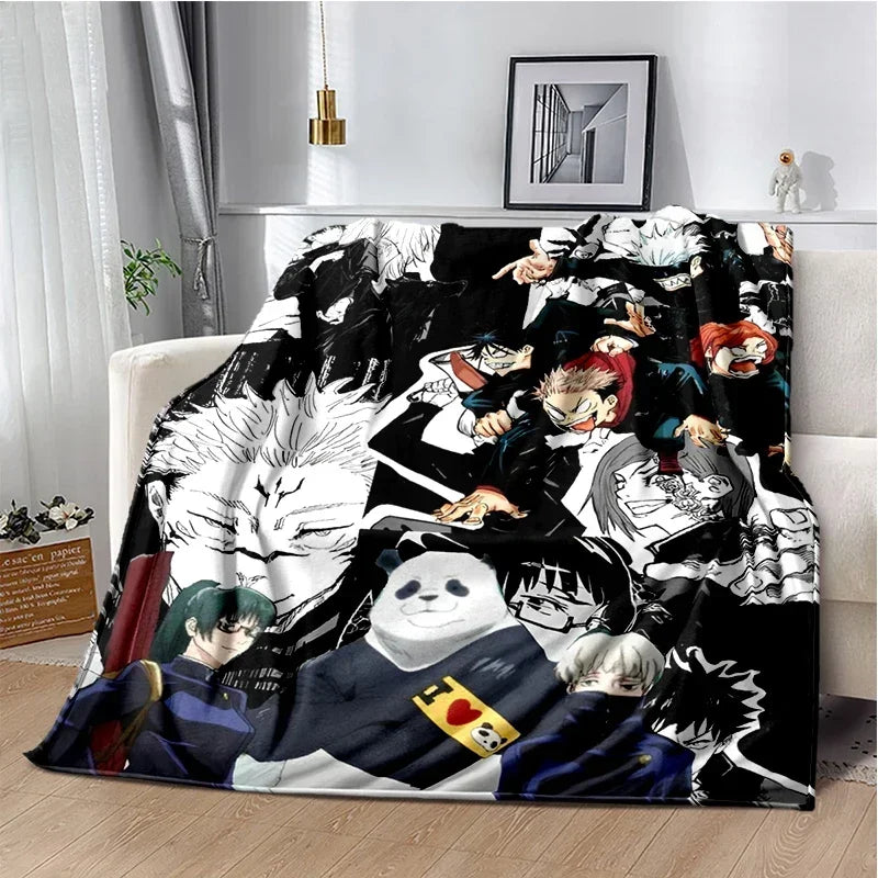 A black and white anime throw blanket featuring characters from Jujutsu Kaisen