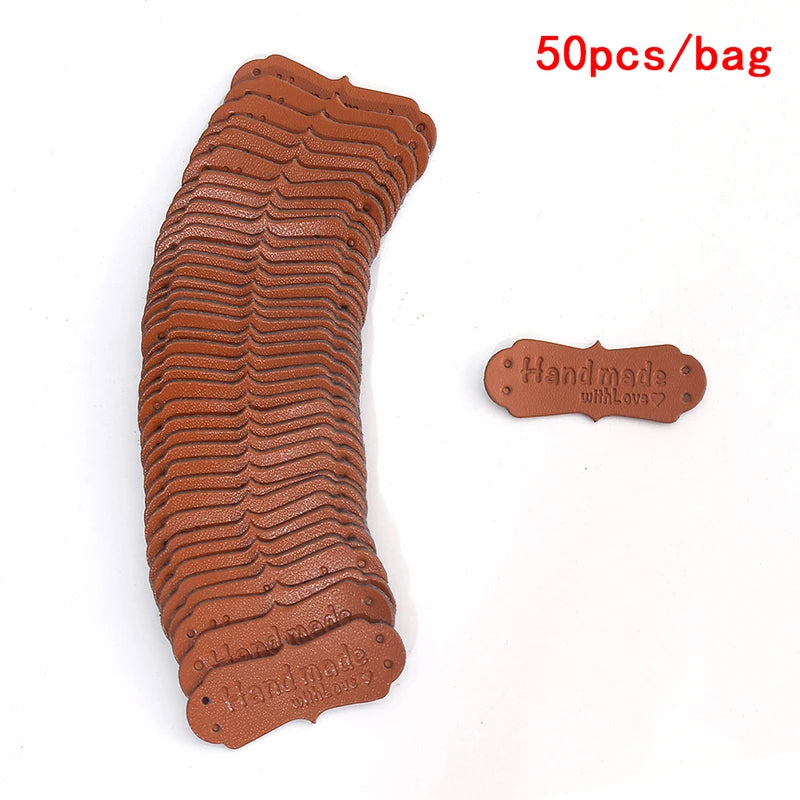 A stack of 50 PU leather embossed tags in a brown color for handmade crafting.