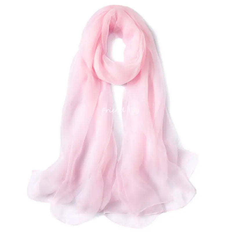A soft pink sheer scarf draped elegantly.