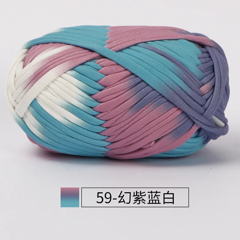 A ball of hand-dyed fabric strip yarn featuring horizontal stripes of teal, pink, and white.