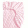 A pink soft plush mattress and diaper changing cover with a textured surface.