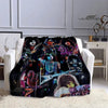 A black printed flannel travel blanket featuring various rock and metal band imagery.