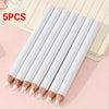 Five white bamboo chalk pencils with wooden tips arranged diagonally on a light pink surface.