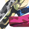 A variety of camouflage patterned elastic stretch ribbons in black, olive green, and pink are displayed.