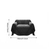 Black bohemian striped sofa cover with a textured fabric shown flat.