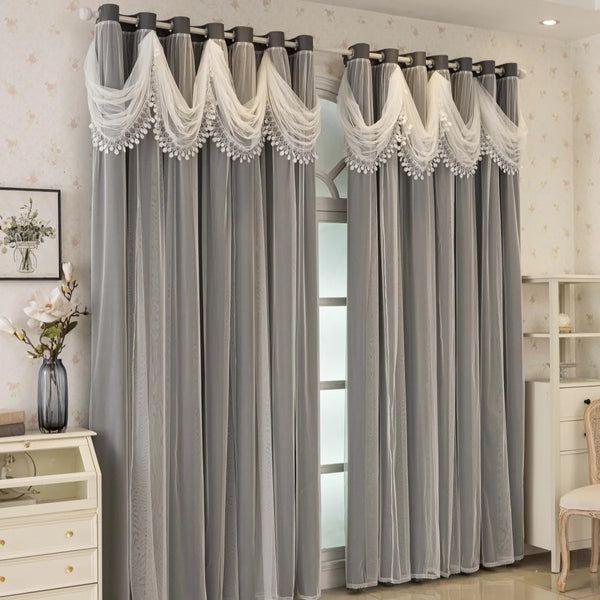 Gray blackout curtains with decorative wave pattern details hanging in a doorway.
