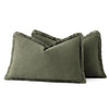 A dark olive green linen throw pillow cover with a fringed edge.