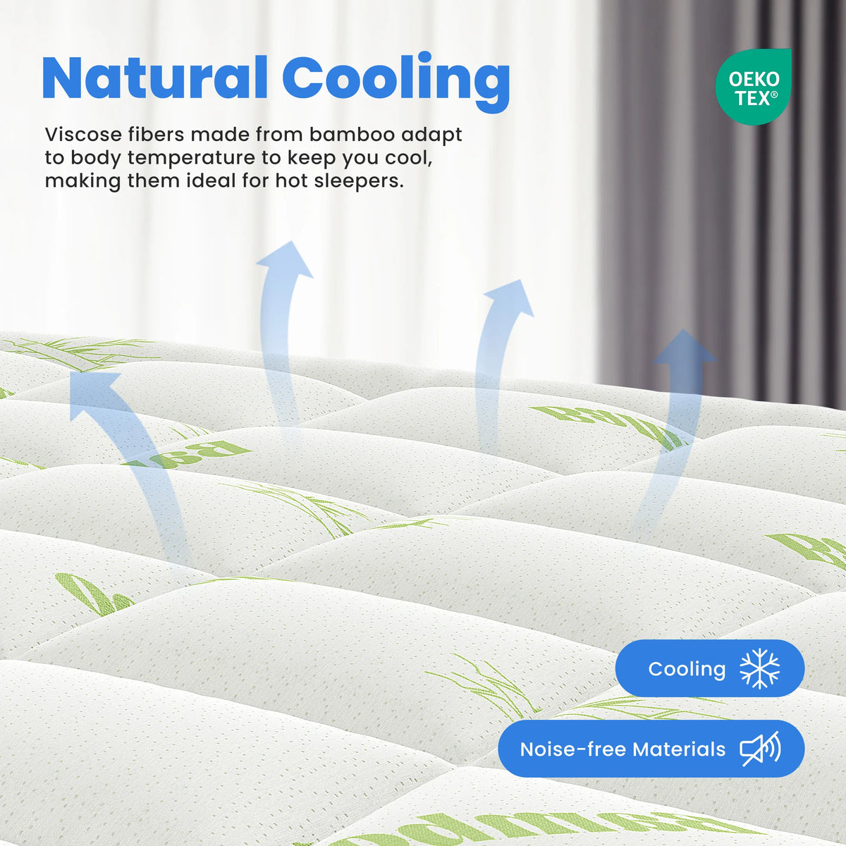A close-up view of a white bamboo viscose mattress topper with green accents, illustrating natural cooling fibers.