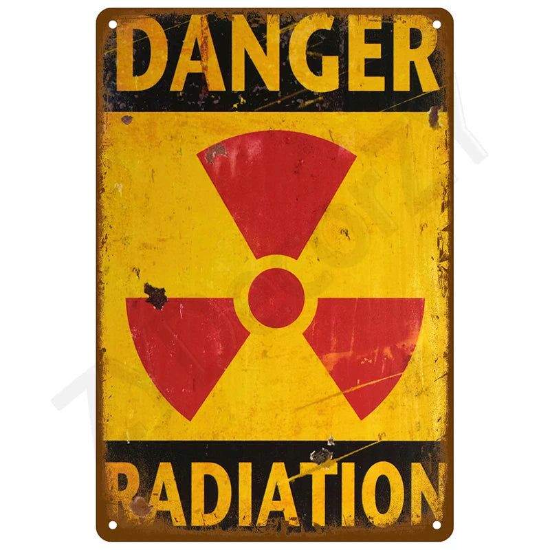 Vintage metal warning sign with yellow background and red radiation symbol and the word DANGER RADIATION