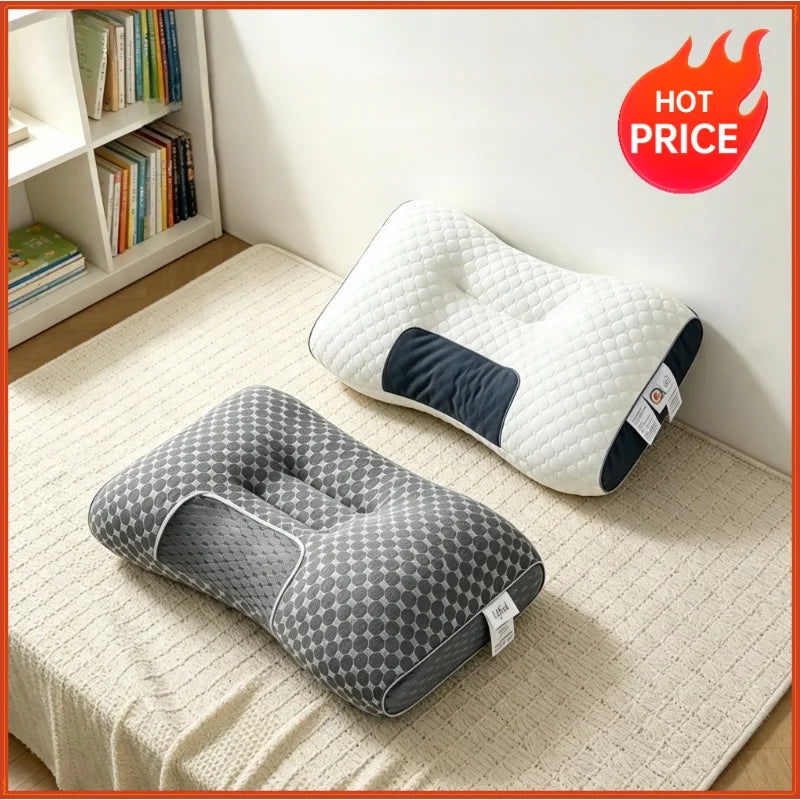 A white and gray ergonomic contour neck pillow resting on a light-colored rug.