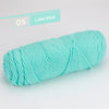 A skein of Lake Blue premium worsted cotton yarn is shown in a coiled form.