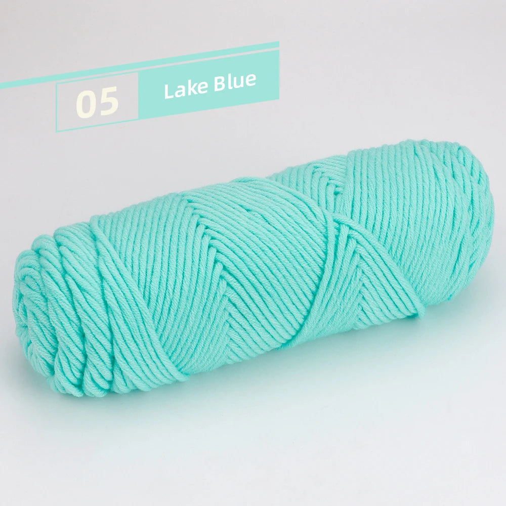 A skein of Lake Blue premium worsted cotton yarn is shown in a coiled form.