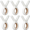 A set of white heavy-duty plastic clothespins with rust-resistant springs shown in various angles.