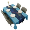 A blue rectangular waterproof tablecloth set for dining or party decor with place settings and a candlestick.