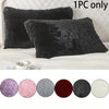 A collection of nine round faux fur pillow covers in various shades including purple pink gray and black displayed on a white