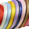 Rolls of 6mm gold-edged satin ribbon in various pastel and jewel tones