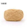 A ball of light beige matte chenille yarn used for knitting and crochet projects.