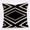 Geometric black and white throw pillow covers featuring a repeating diamond pattern