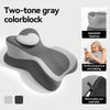 A two-tone gray colorblock pillow designed for comfortable lying prone support.