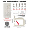 Cream beading machine set with various sized white beads and a handheld tool