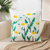 White canvas throw pillow cover embroidered with yellow and green daisy flowers