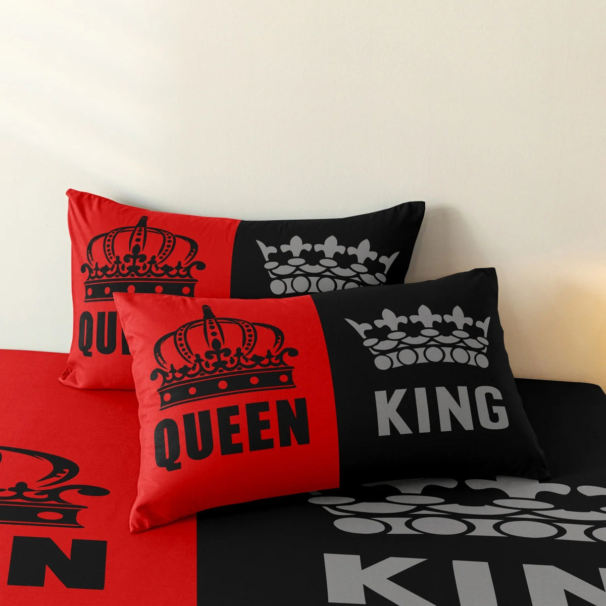 A set of three pillows featuring black and grey designs with crown motifs for a couple theme.