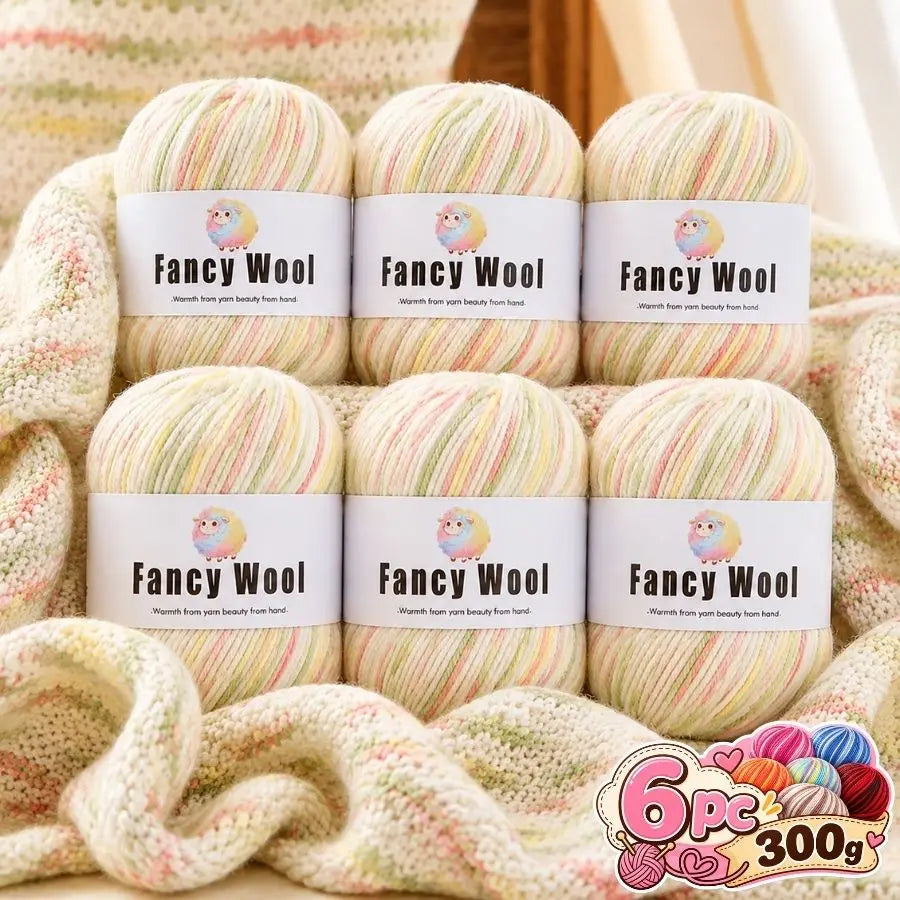 A set of six balls of fancy wool yarn in various pastel and striped colors for knitting and crochet projects.