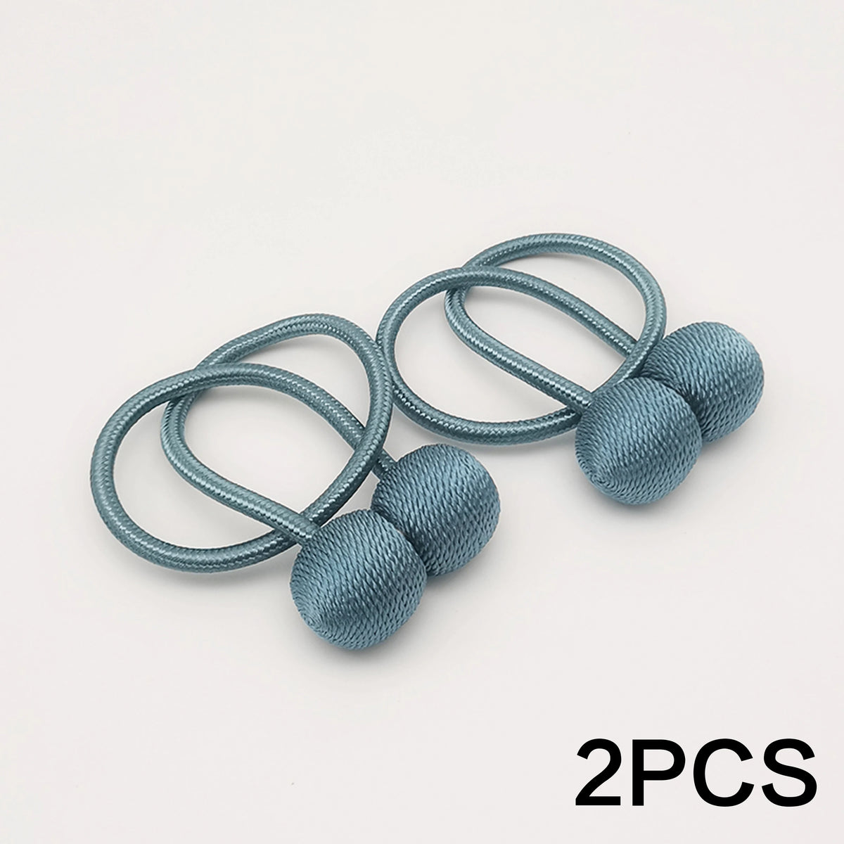 Two silver-blue magnetic ball curtain tiebacks with looped cords