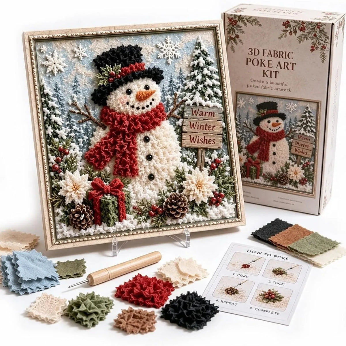 A box and framed piece of fabric art showing a winter scene with a snowman, pine trees, and festive greenery.