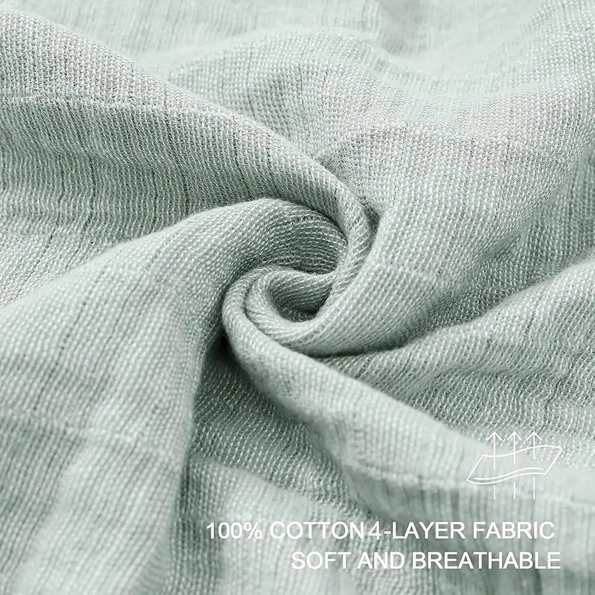 A close-up of a soft, light gray cotton fabric draped and folded to show its texture.