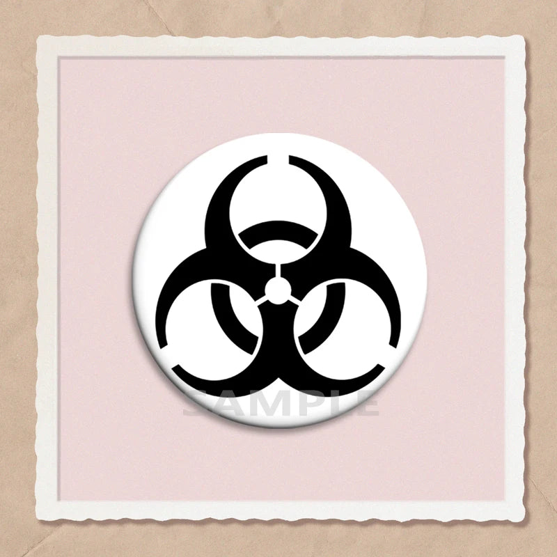 A black biohazard symbol pin on a light pink background inside a white frame.