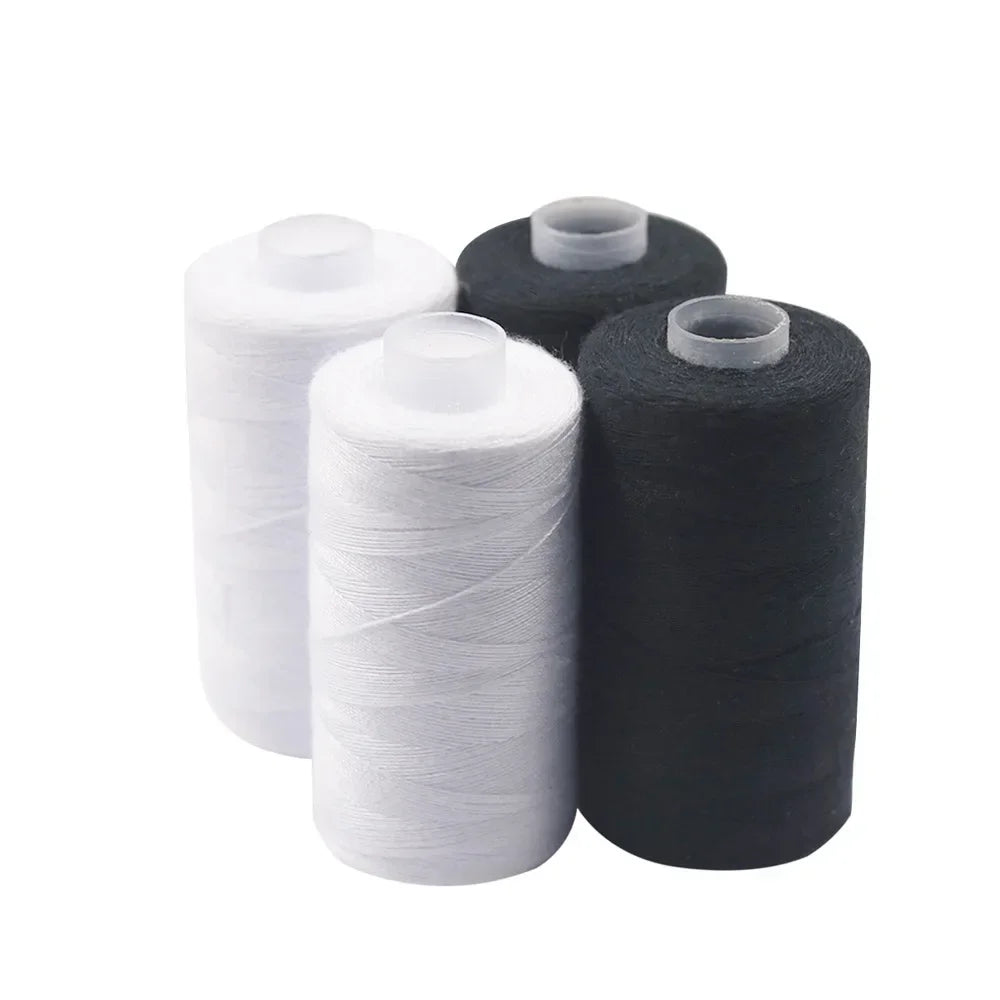 A set of black and white heavy duty polyester sewing thread spools.
