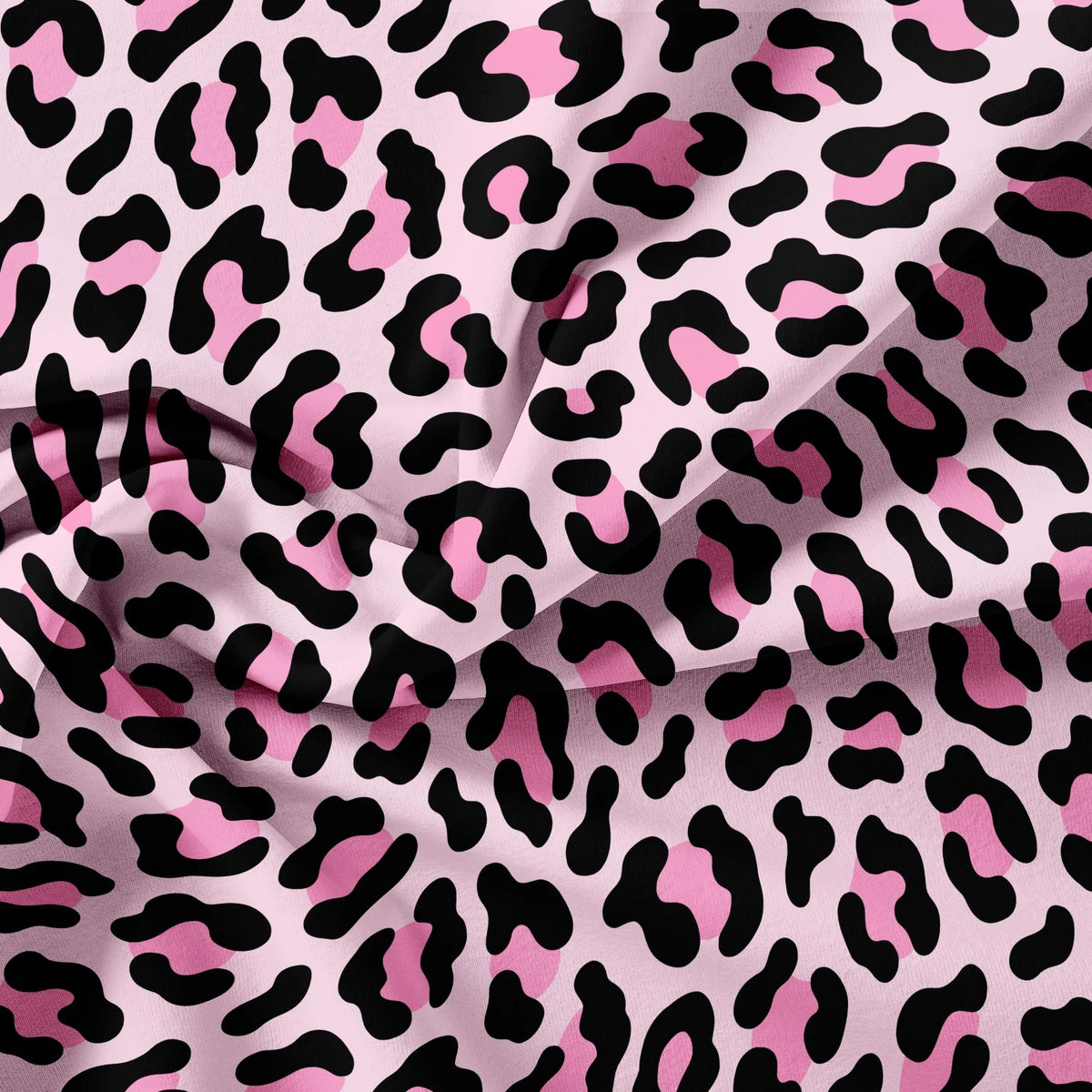 Pink and black leopard print fabric draped in soft folds.
