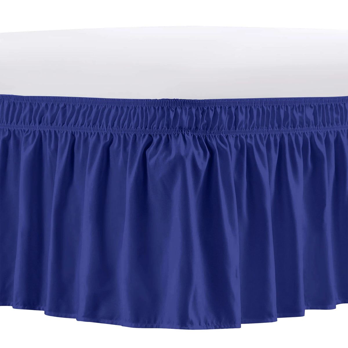 A navy blue elastic bed skirt with ruffled trim.