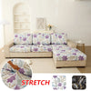 Floral print elastic sofa protective cover displayed on a light beige sofa with a white background.