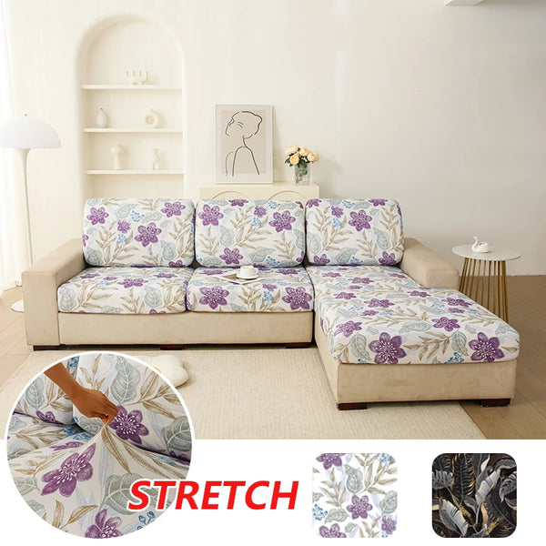 Floral print elastic sofa protective cover displayed on a light beige sofa with a white background.