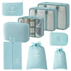 A set of nine light blue and beige mesh storage organizers, including pouches and boxes.