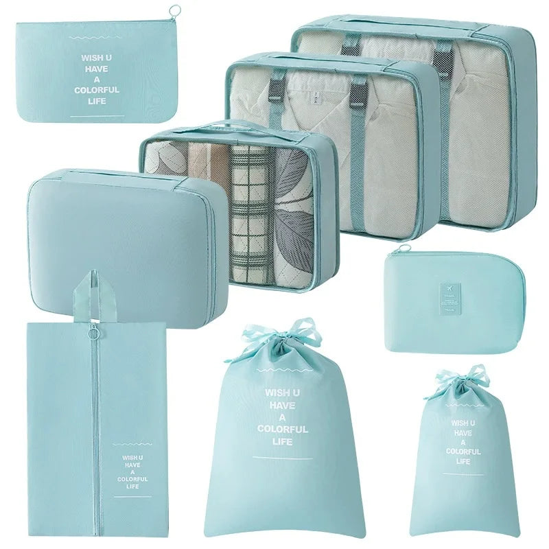 A set of nine light blue and beige mesh storage organizers, including pouches and boxes.