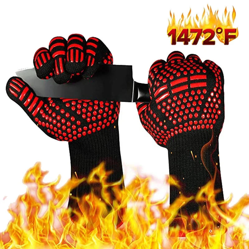 A pair of red and black heat resistant BBQ gloves with silicone grips shown in a fiery context.
