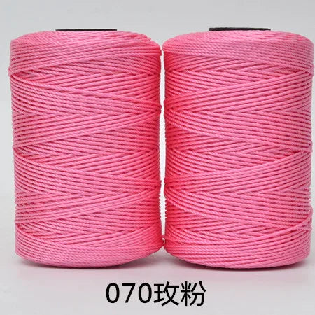 Two spools of pink hand knitting and crochet cord for crafting