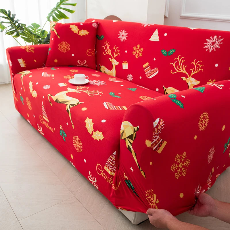 A red stretchable festive sofa cover with gold Christmas patterns and non-slip backing.