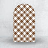 A tall arch backdrop cover featuring a brown and white checkered pattern.