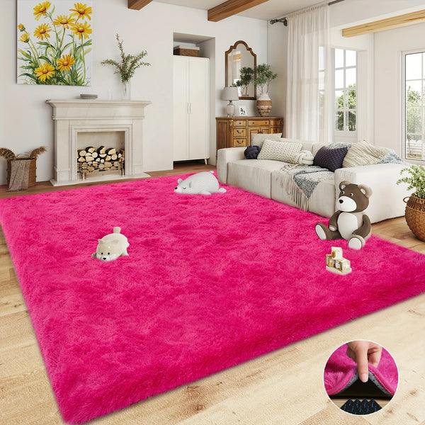 A vibrant pink shaggy plush area rug with various stuffed animal toys on a light wood floor.