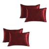 A set of two deep burgundy satin silk pillowcases.
