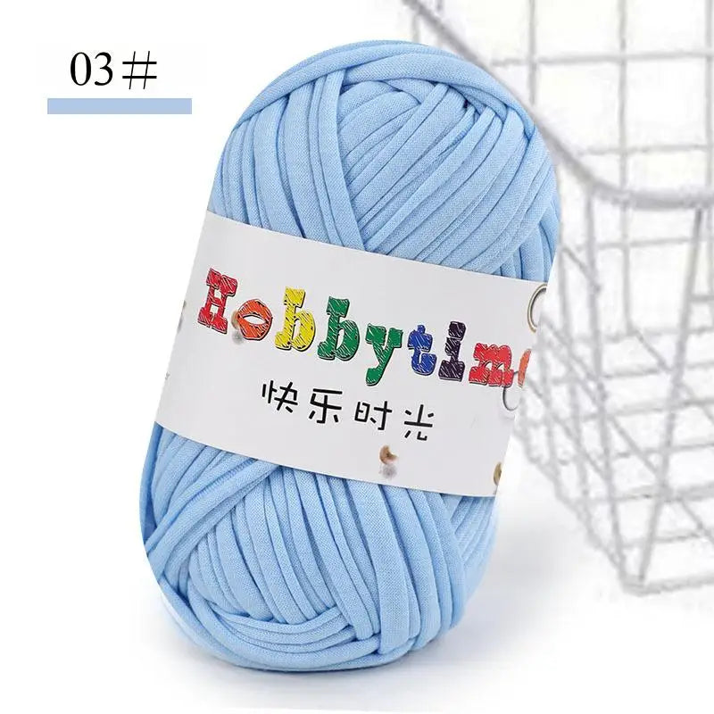 A ball of light blue thick polyester craft yarn for knitting and crochet