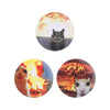 A set of tinplate pin brooches featuring cats against fiery backgrounds.