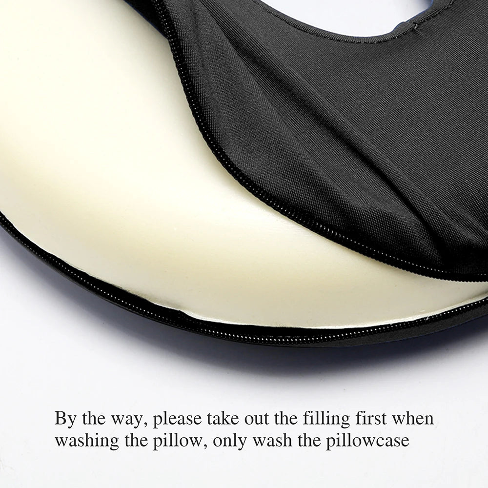A black ear piercing pillow with a light-colored filling is shown, emphasizing the removable pillowcase.